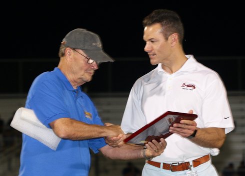 Adventist physician Christopher Verioti honored for his work on the sidelines Bob Clement, a Lemoore Kiwanis member, honors Adventist orthopedic surgeon Dr. Christopher Verioti for providing professional medical coverage of the 51st annual Tulare-Kings All-Star Football game on June 23.